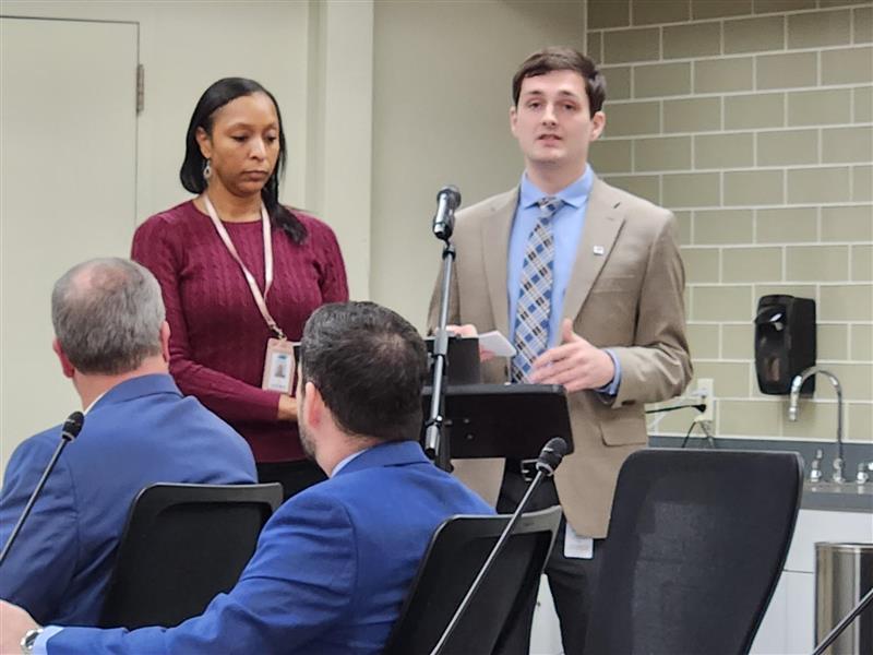 Public Outreach Coordinator Gus Maxwell provides an overview of the new Student Transit Riders Commission to members of the Transportation Disctrict Commission of Hampton Roads.
